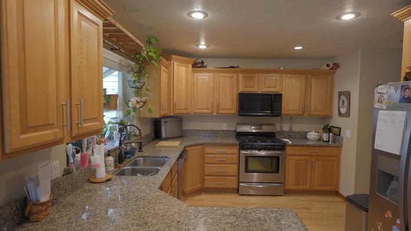 Kitchen with original honey oak cabinets before refinishing