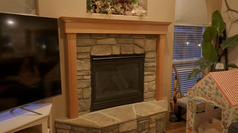 Fireplace mantel with unpainted honey oak wood trim