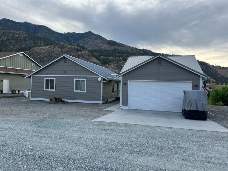 Front view of house with gray siding before repainting